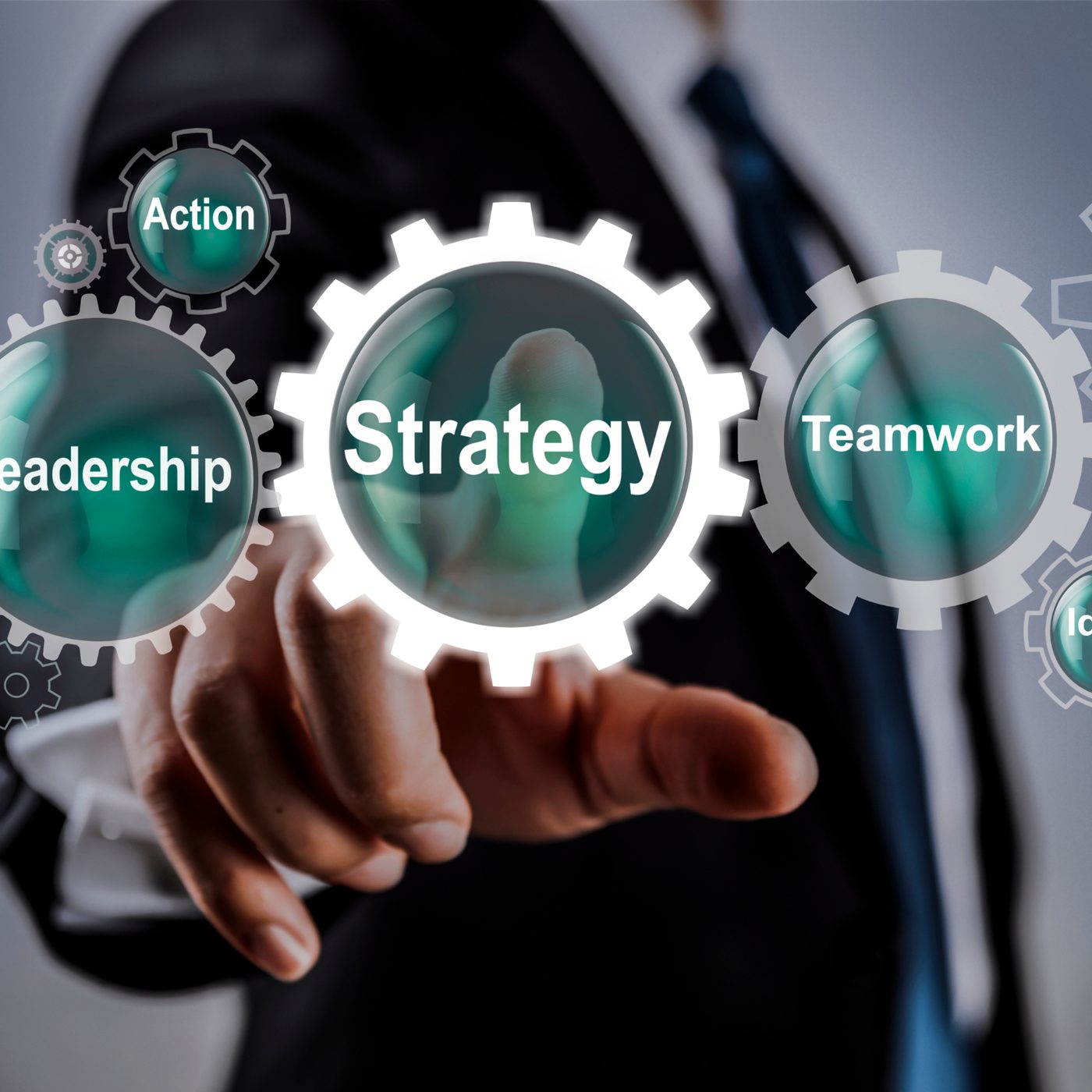 Hand selecting the Strategy gear among Leadership, Action, Teamwork and Innovation